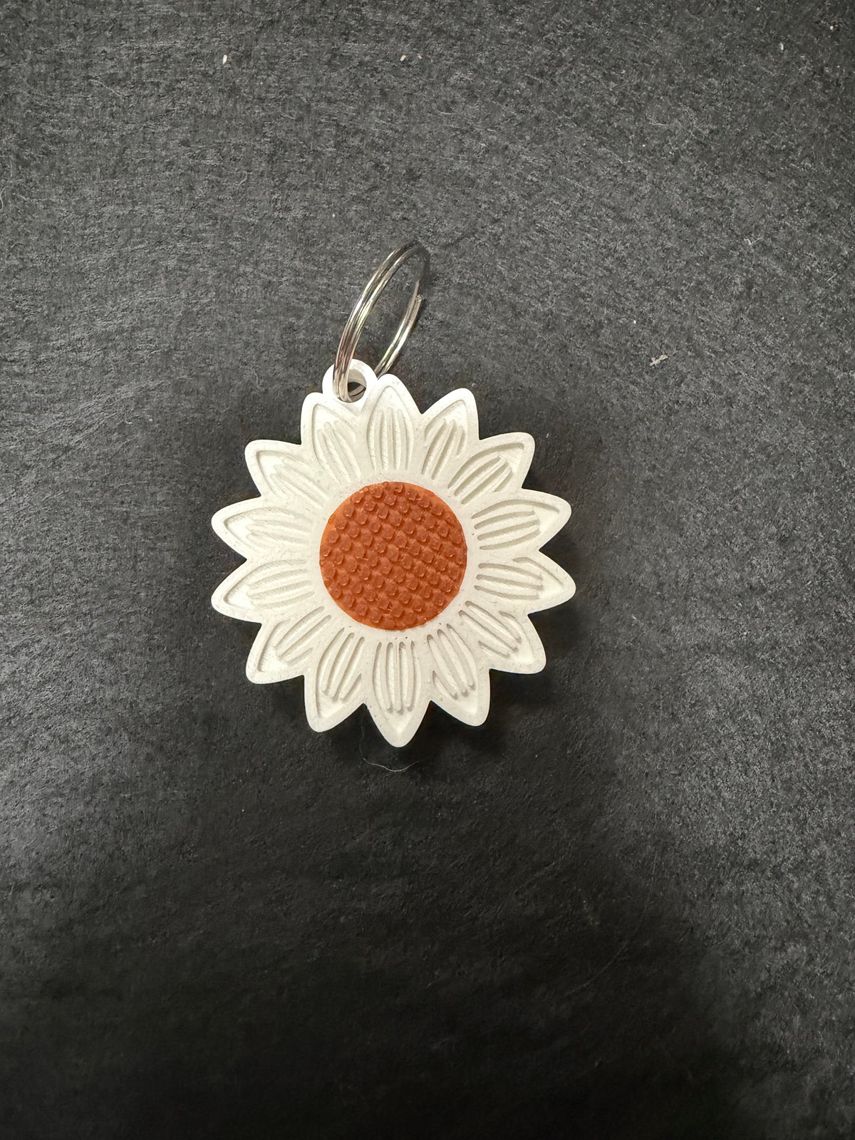 Daisy can opener keychain