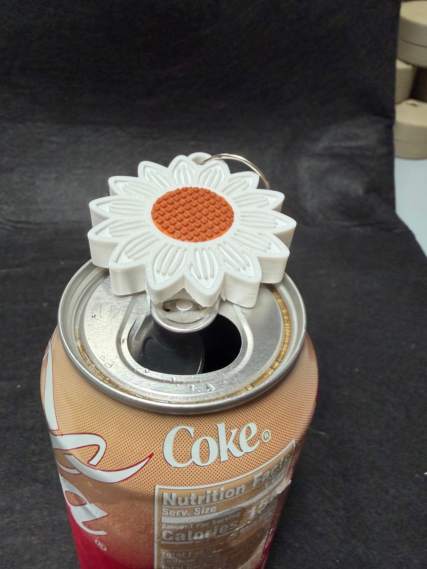 Daisy can opener keychain
